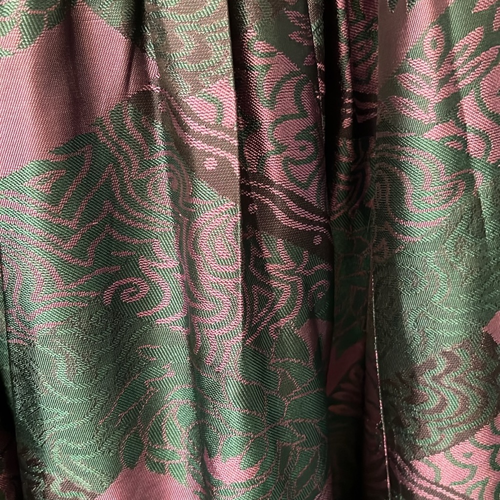 Skirt waistband is elastic colors purple &green. Skirt is below the knee midi - Picture 3 of 7